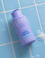 A 400ml blue bottle of Epzen Triple Moisture Body Wash with hyaluronic acid and coconut oil on a white background.