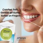 Close-up of Dr Tung's Smart Floss in a pink oval dispenser on a white background.