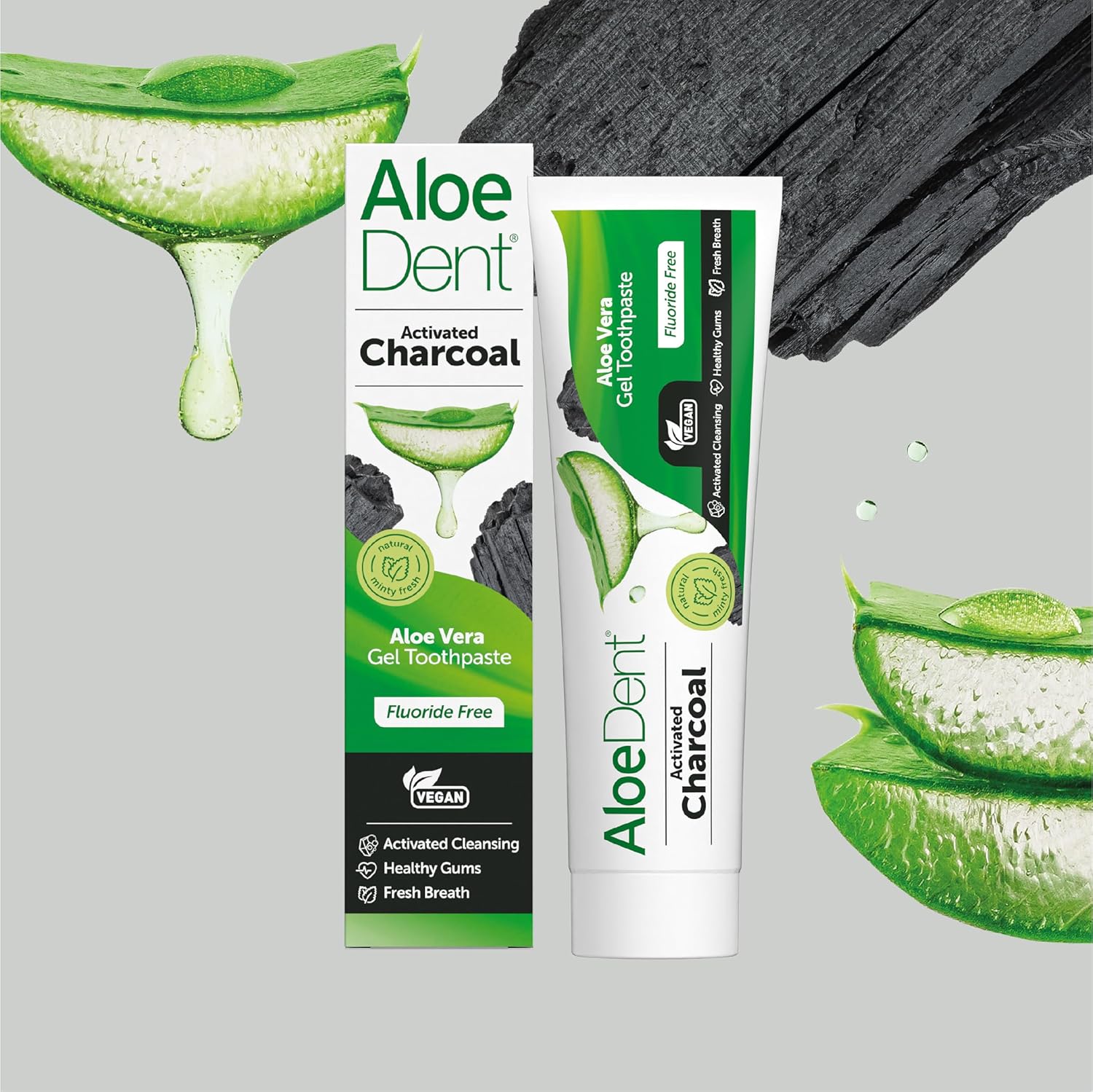 Side of Aloe Dent Charcoal Toothpaste box highlighting natural ingredients like aloe vera and tea tree oil.
