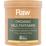 Amazonia Raw Organic Multivitamin Pineapple 100g tub with tropical leaf illustrations on a white background.