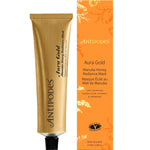 Antipodes Aura Gold Manuka Honey Radiance Mask 75ml tube and box featuring a golden cream texture and botanical illustrations.