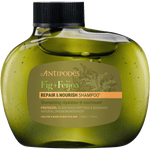 340ml bottle of Antipodes Fig + Feijoa Repair & Nourish Shampoo featuring a sleek, dark green asymmetrical design.