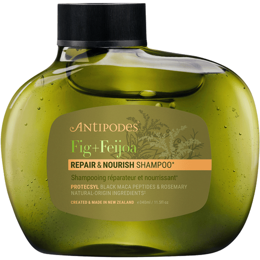 340ml bottle of Antipodes Fig + Feijoa Repair & Nourish Shampoo featuring a sleek, dark green asymmetrical design.