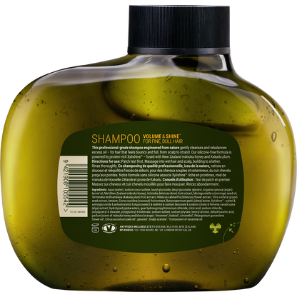 Back of Antipodes Manuka + Orange Shampoo 340ml bottle showing ingredients and directions on a botanical label.