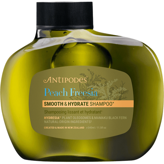 340ml bottle of Antipodes Peach Freesia Smooth and Hydrate Shampoo featuring a brown bottle and minimalist label.