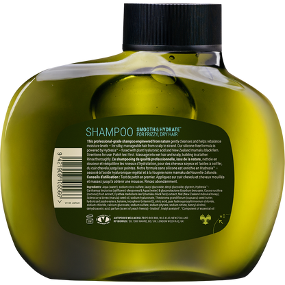 Back of Antipodes Peach Freesia shampoo bottle showing ingredients and directions on a minimalist white and brown label.
