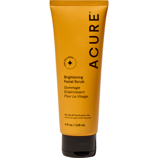 Yellow tube of ACURE Brightening Facial Scrub, 118ml, with sea kelp and French green clay on a white background.