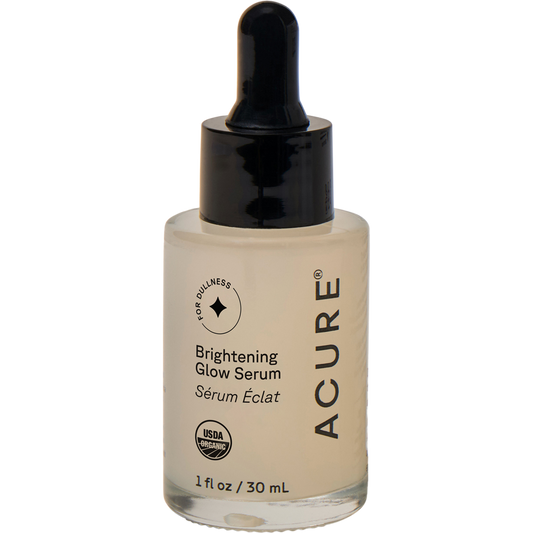 30ml bottle of ACURE Brightening Glowing Serum with argan, pumpkin, and cranberry oils for dull skin.