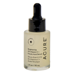 White 30ml bottle of Acure Brightening Vitamin C and Ferulic Acid oil-free serum with a yellow label and pump.