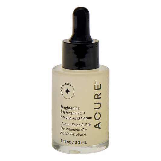 White 30ml bottle of Acure Brightening Vitamin C and Ferulic Acid oil-free serum with a yellow label and pump.