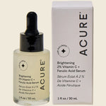 Acure Brightening Vitamin C and Ferulic Acid serum bottle and box featuring pineapple and papaya illustrations.