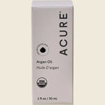 ACURE The Essentials Argan Oil 30ml packaging box with a yellow and white geometric design on a white background.