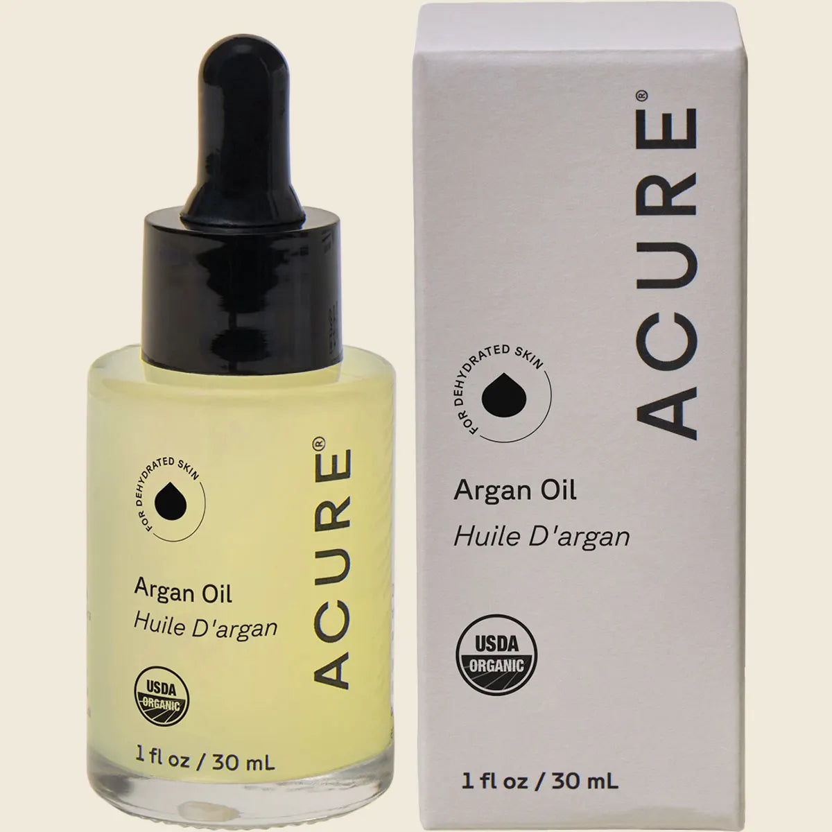 ACURE The Essentials Argan Oil 30ml bottle and packaging box featuring a yellow and white geometric design.