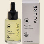 ACURE The Essentials Argan Oil 30ml bottle and packaging box featuring a yellow and white geometric design.