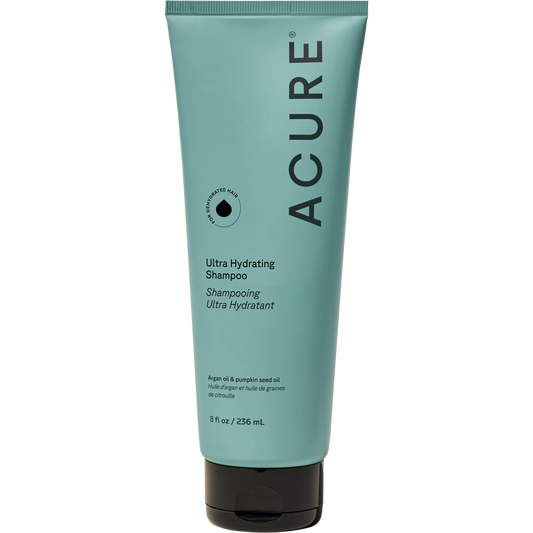 236.5ml tube of Acure Ultra Hydrating Shampoo with argan and pumpkin seed oil for dry, damaged, or curly hair.