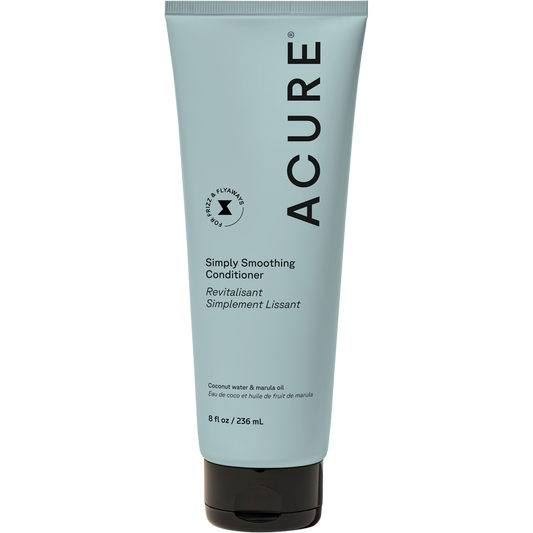 Acure Simply Smoothing Conditioner Coconut 236.5ml in a muted blue tube.