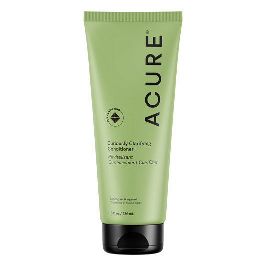 Acure Curiously Clarifying Conditioner in a 236.5ml white and yellow squeeze tube with lemongrass and argan oil.