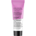 Back of Acure Radically Rejuvenating Night Cream purple tube showing instructions and ingredients on a white background.