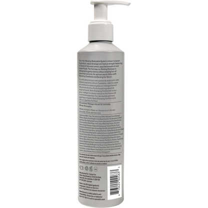 Back view of a 250ml purple aluminum bottle of ACURE Bonding Shampoo with product details and directions.