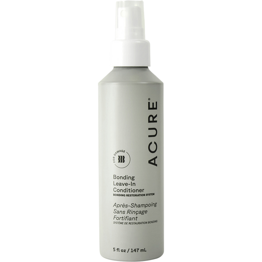 White spray bottle of ACURE Bonding Leave-In Conditioner 147ml with a clear cap and purple and blue label.