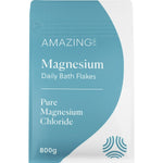 800g bag of Amazing Oils Magnesium Daily Bath Flakes with pure magnesium chloride and a blue beach-themed label.