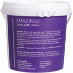 2kg tub of Amazing Oils Magnesium Sleep Bath Flakes with lavender and chamomile against a white background.