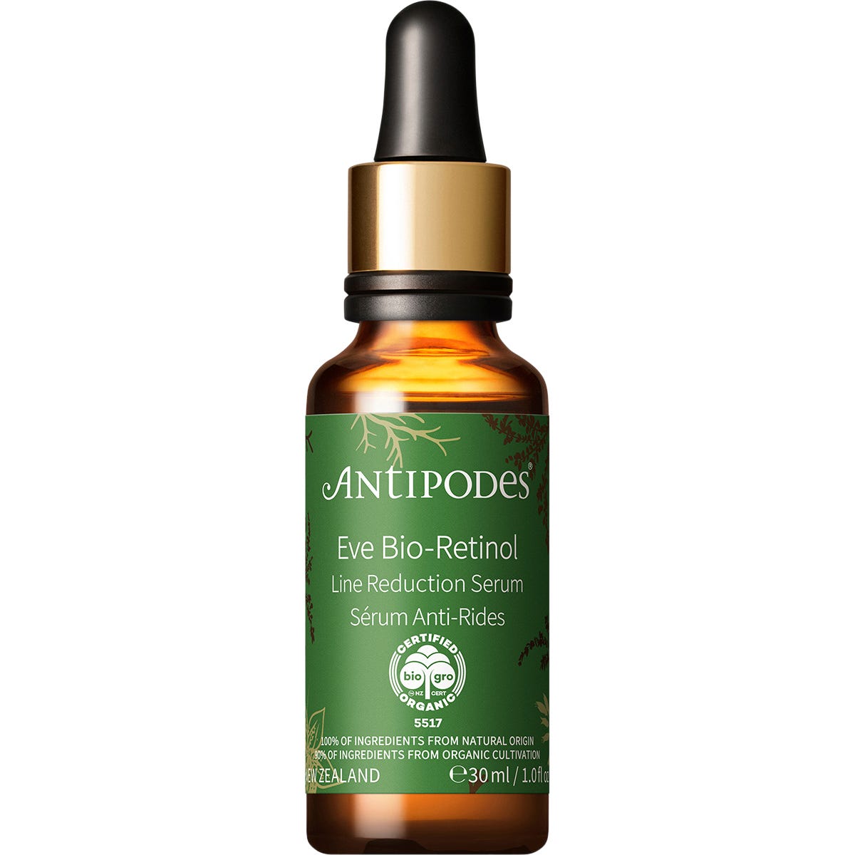 Antipodes Eve Bio-Retinol Serum in a glass bottle next to its gold and green cardboard box.