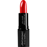 Antipodes Forest Berry Red 4g lipstick shown in a black tube next to its botanical-themed cardboard box.