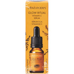 10ml mini bottle of Antipodes Glow Vitamin C Serum with gold detailing and white dropper on a white background.
