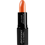 Antipodes Golden Bay Nectar 4g lipstick in a black tube, showing its creamy peach-honey neutral shade.