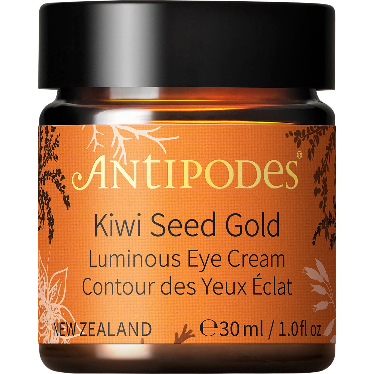 Open glass jar of Antipodes Kiwi Seed Gold Luminous Eye Cream showing its creamy texture with 23K gold flakes.