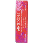 Antipodes Piha Beach Tangerine lipstick in an open black tube on a white background.