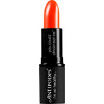 Antipodes Piha Beach Tangerine lipstick in an open black tube showing the vibrant orange-red shade.