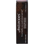Antipodes Queenstown Hot Chocolate lipstick in a black tube with a decadent brown shade on a white background.