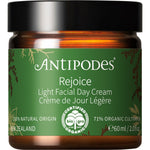 Antipodes Rejoice Light Facial Day Cream 60ml green and gold tube on a white background.