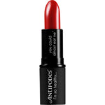 Antipodes Ruby Bay Rouge 4g lipstick tube and box with botanical designs and a rich red shade swatch.