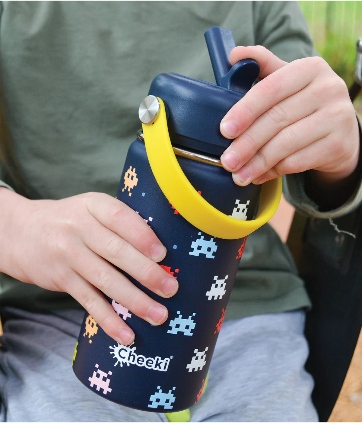 Navy 400ml Cheeki Kids arcade bottle with straw lid and soft carry handle on a white background.