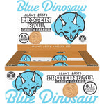 Retail display box of Blue Dinosaur Caramel Cashew Protein Balls containing multiple 40g snack packs on a white background.