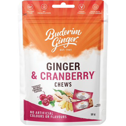 A 12-pack of Buderim Ginger Ginger & Cranberry Chews in red and white 50g bags with a ginger and cranberry design.