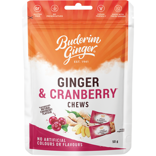 A 12-pack of Buderim Ginger Ginger & Cranberry Chews in red and white 50g bags with a ginger and cranberry design.