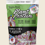 1kg tub of Botanika Blends Plant Protein Bubble O'Wiz with a colorful, wizard-themed label on a white background.