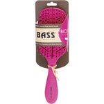 Pink Bio-Flex detangler hair brush in leaf shape with a natural plant starch handle and flexible nylon pins.