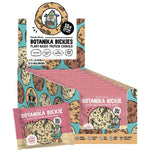 Birthday Cake Botanika Bickie protein cookie and 12-pack box with colorful sprinkles on a white background.
