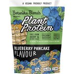 500g tub of Botanika Blends Blueberry Pancake plant protein featuring a purple label with blueberries and pancakes.