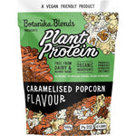500g bag of Botanika Blends Caramelised Popcorn plant protein with a cartoon wizard and popcorn illustrations.