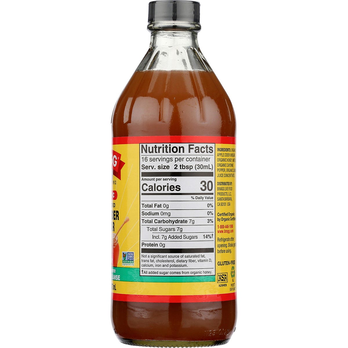 Bragg Apple Cider Vinegar Honey Cayenne 473ml bottle with a yellow label on a white background.