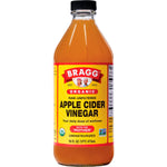 473ml glass bottle of Bragg Organic Apple Cider Vinegar with the Mother, raw and unfiltered, on a white background.