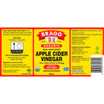946ml glass bottle of Bragg Organic Apple Cider Vinegar, unfiltered and raw, on a white background.