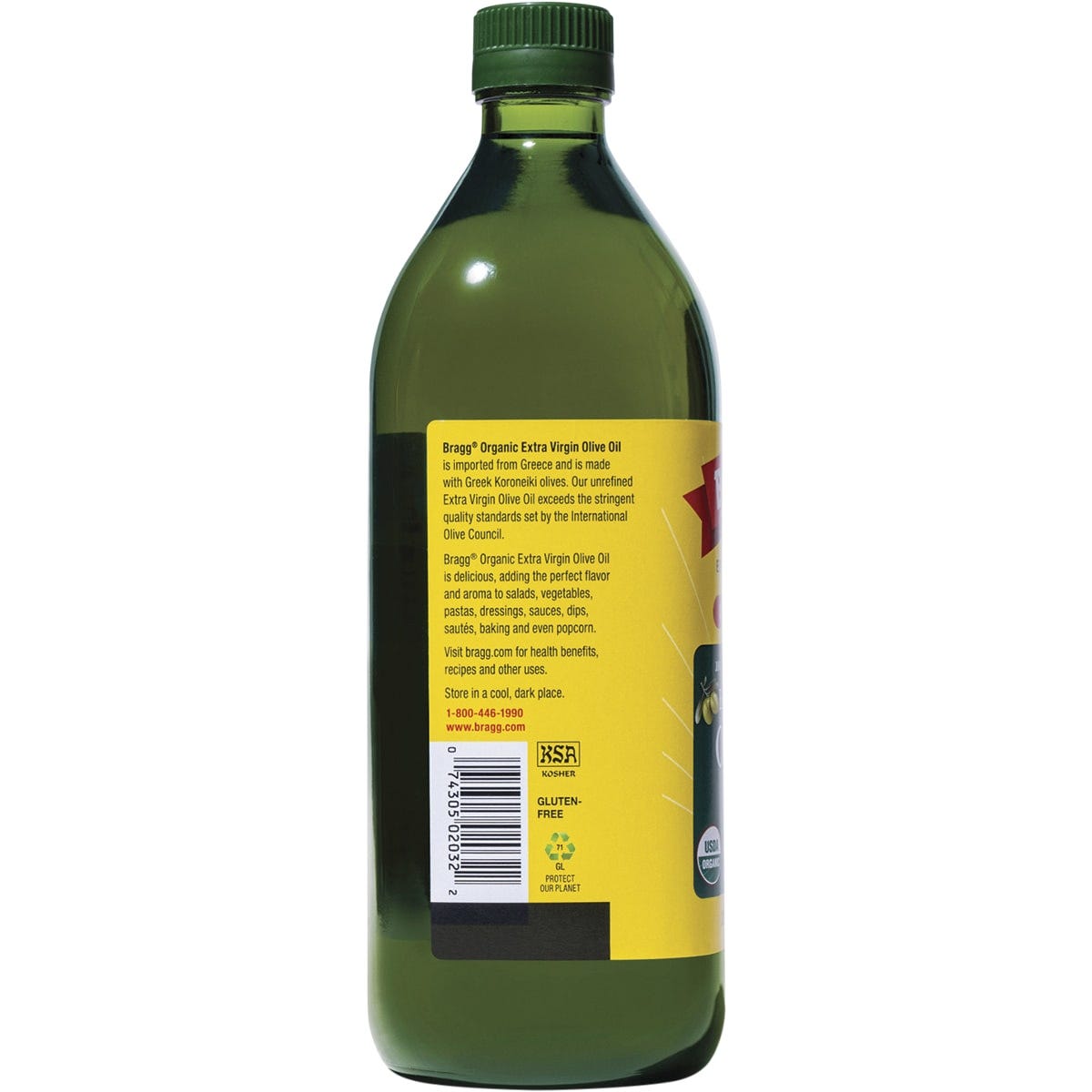 Side view of a 946ml Bragg Organic Olive Oil bottle showing nutrition facts and cold-pressed benefits.