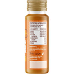 50ml bottle of Buderim Ginger Australian Ginger Vitality Shot with a white label and fresh ginger root illustrations.